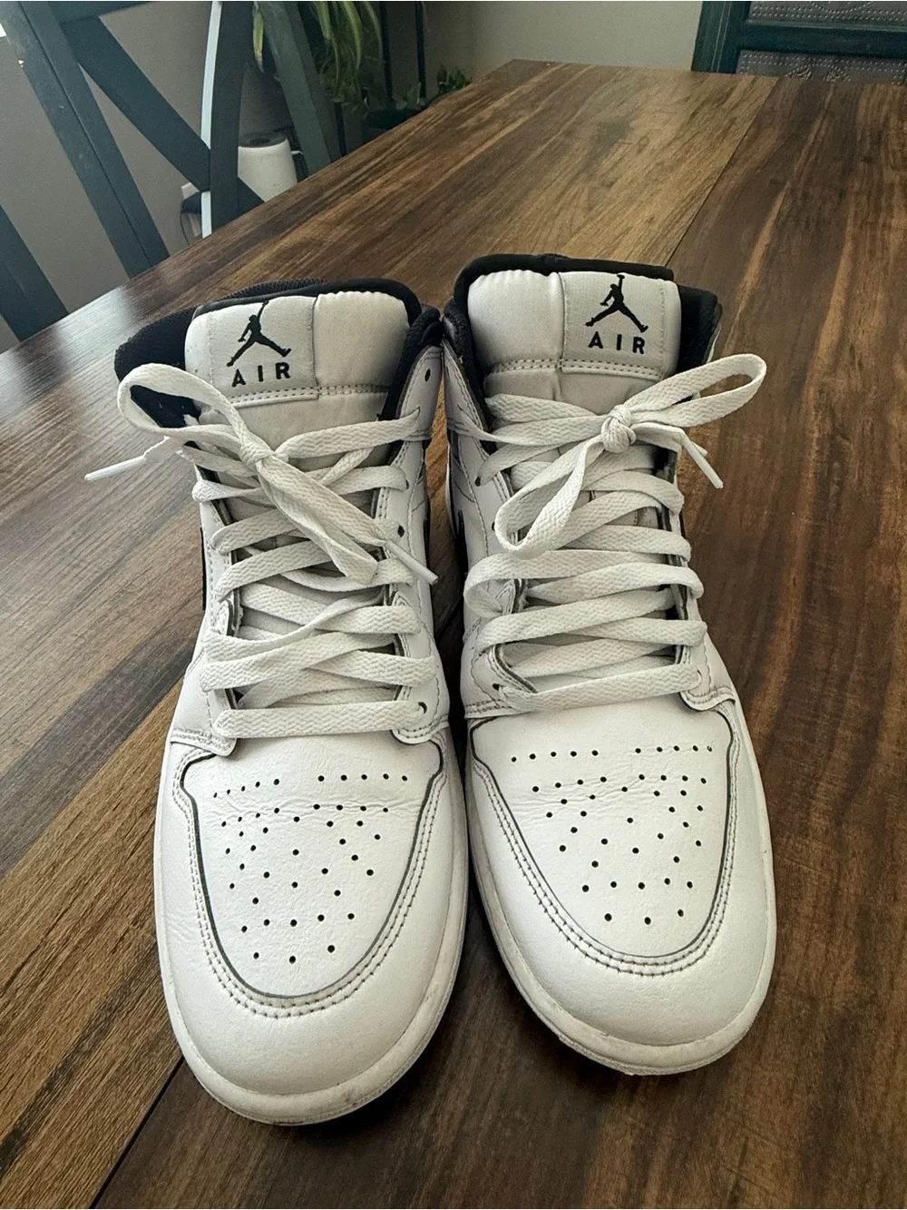 Nike Air Jordan 1 White and Black Mid-Top Sneakers
